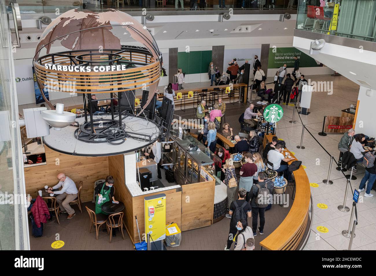 Starbucks coffe shop in the departures lounge with passengers queing to buy drinks and refreshments, Dublin Airport, Dublin, Ireland Stock Photo