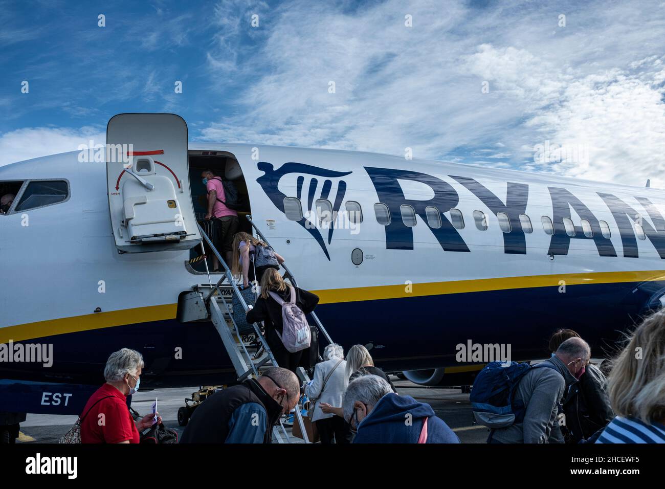 Passengers boarding a Ryanair plane on the tarmac at Dublin Airport, Dublin, Ireland Stock Photo