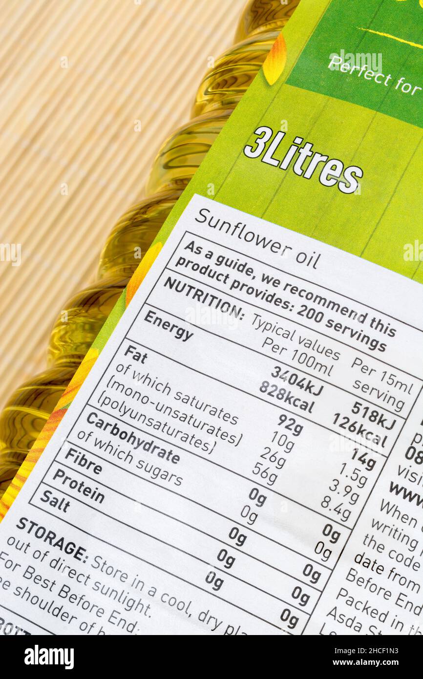 Close-up of food nutrition label on 3-litre ASDA own-label sunflower oil plastic bottle. For UK food packaging, food standards, dietary information. Stock Photo