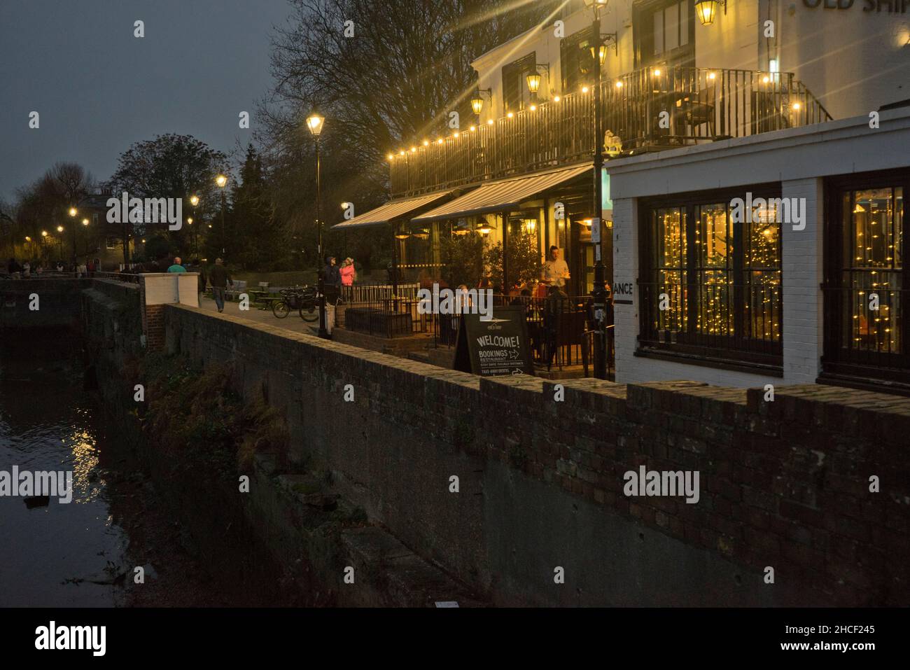 Night view of a pub and restaurant on river Thames in Hammersmith