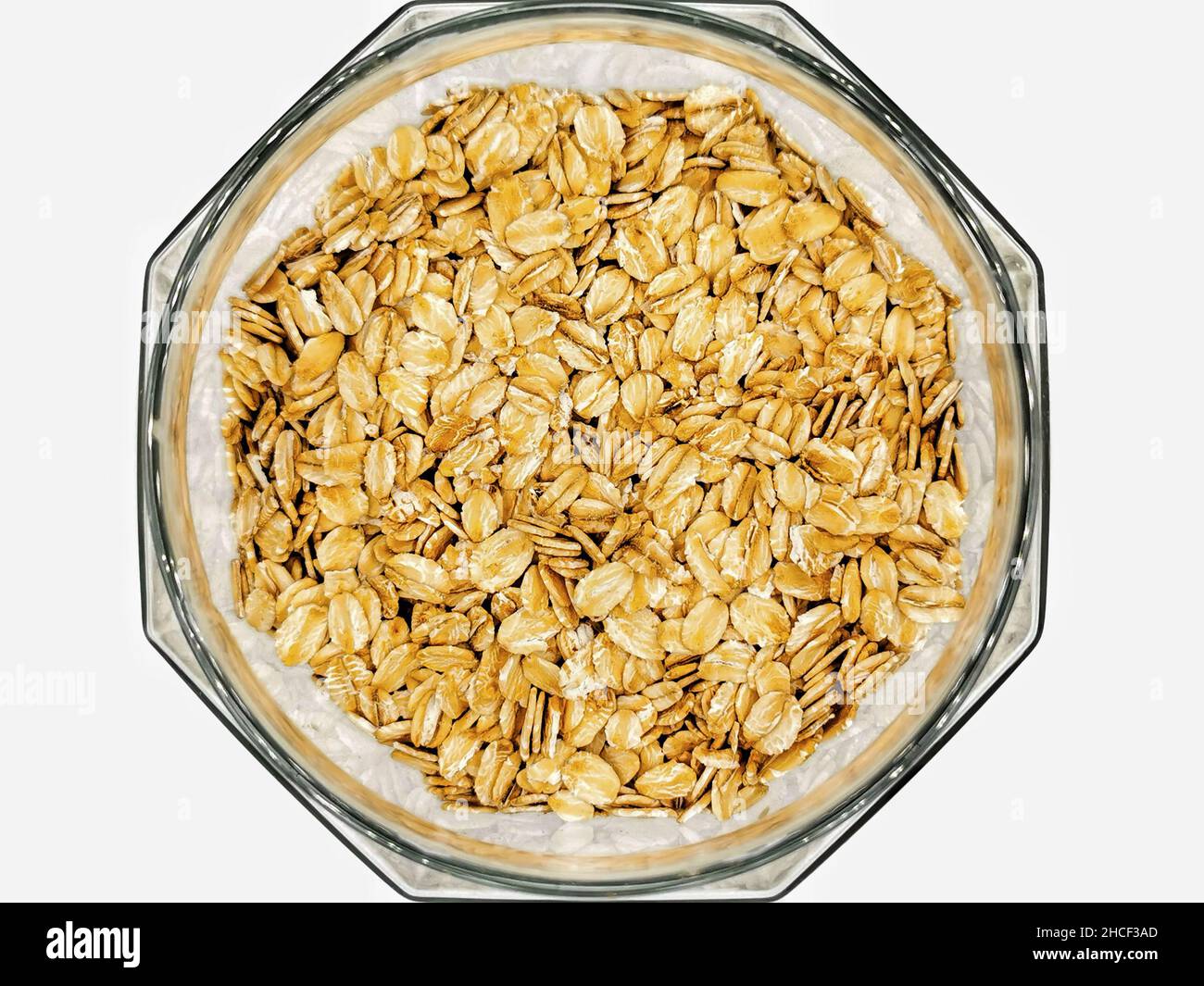 Bowl of oats isolated on white. Top view. Healthy lifestyle, healthy eating, vegan food concept Stock Photo