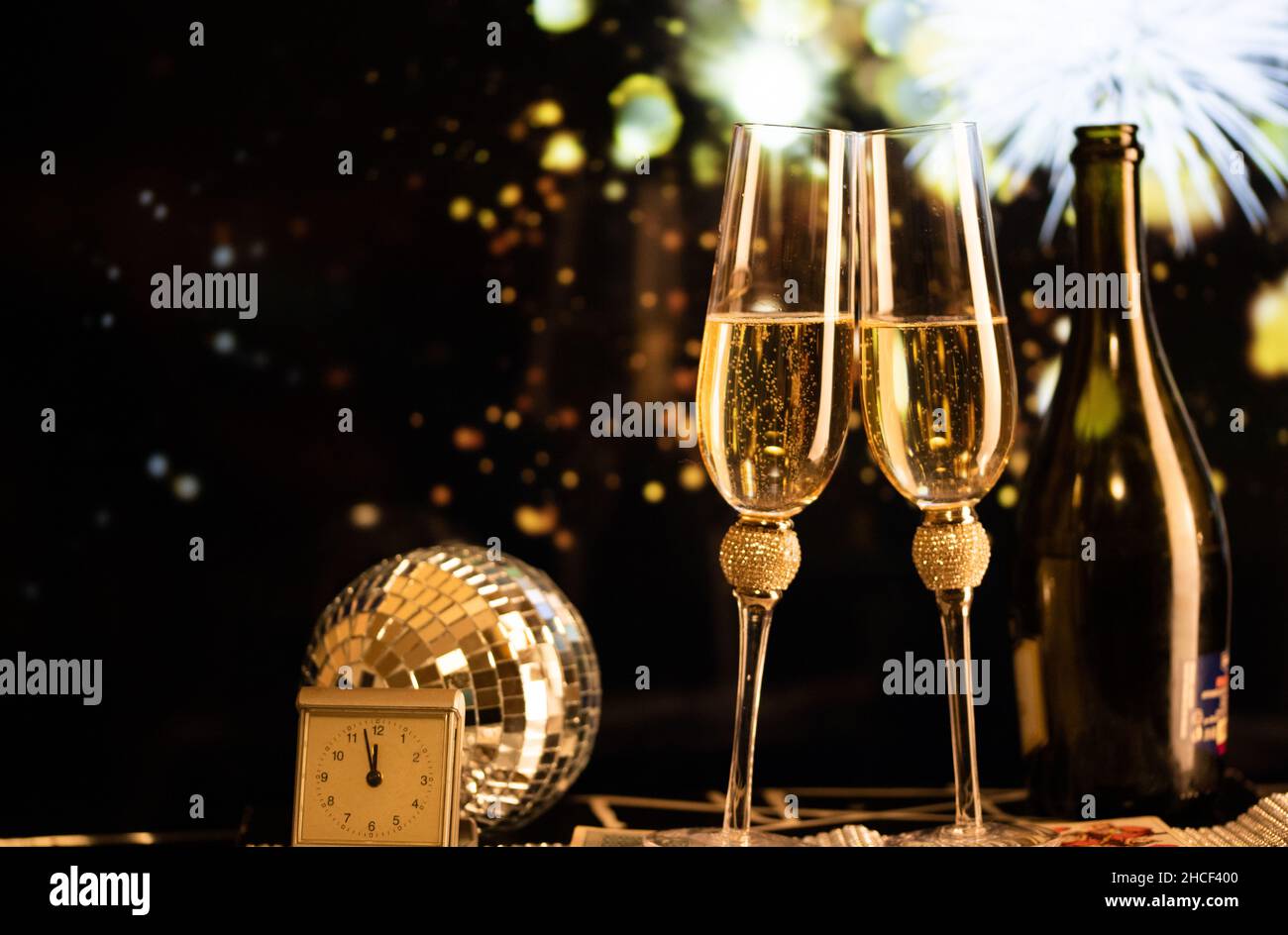 happy New Year champagne glasses and fireworks celebration background ...