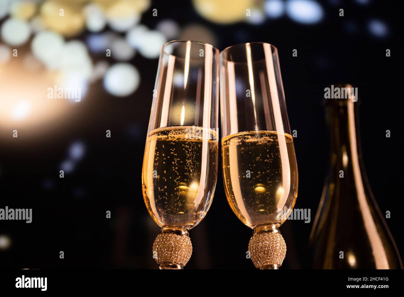 happy New Year champagne glasses and fireworks celebration background ...