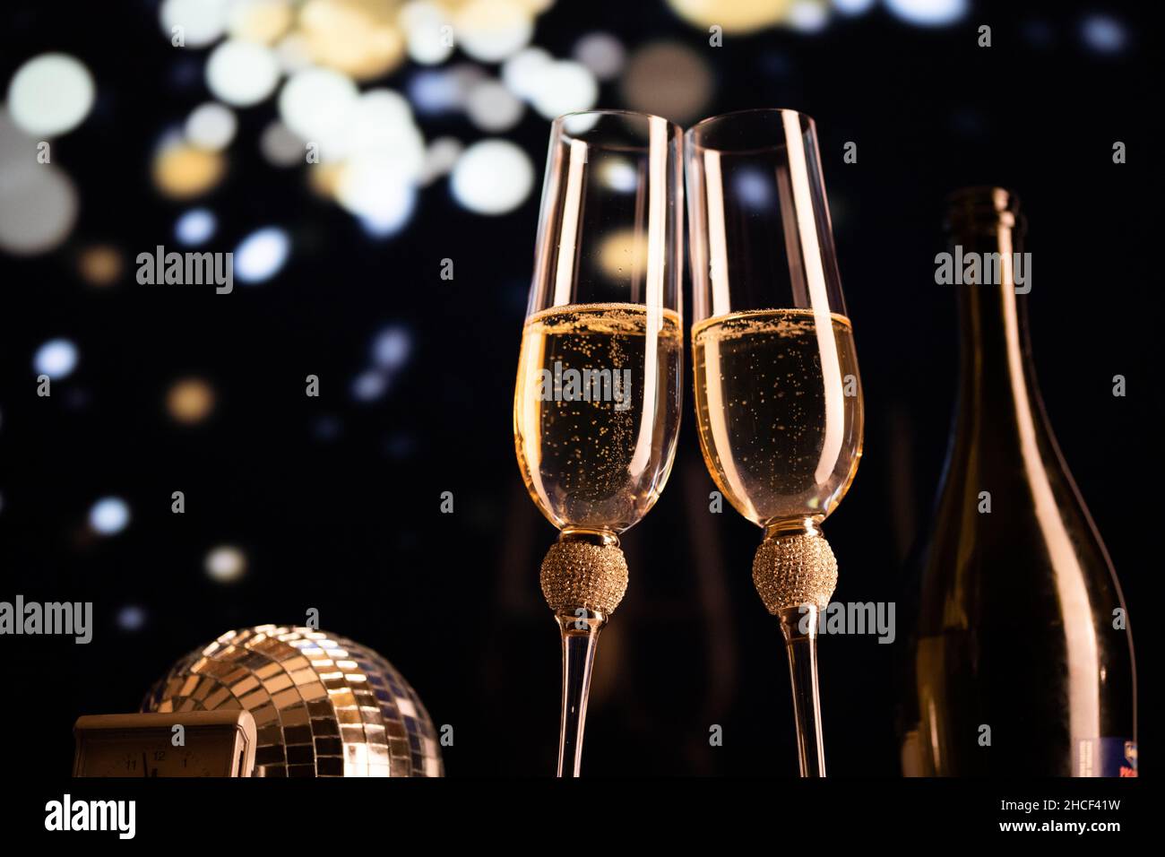 happy New Year champagne glasses and fireworks celebration background ...