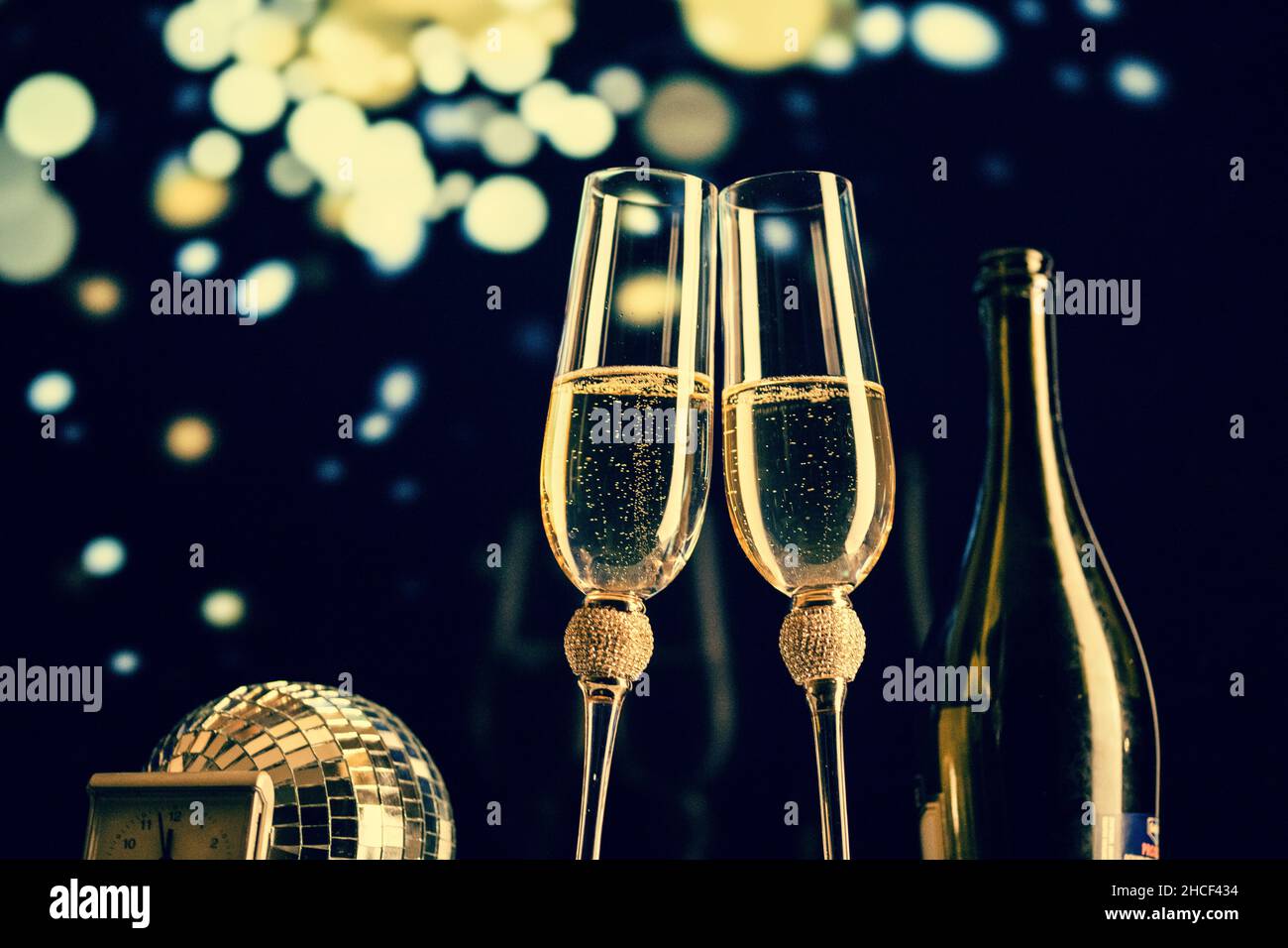 happy New Year champagne glasses and fireworks celebration background ...