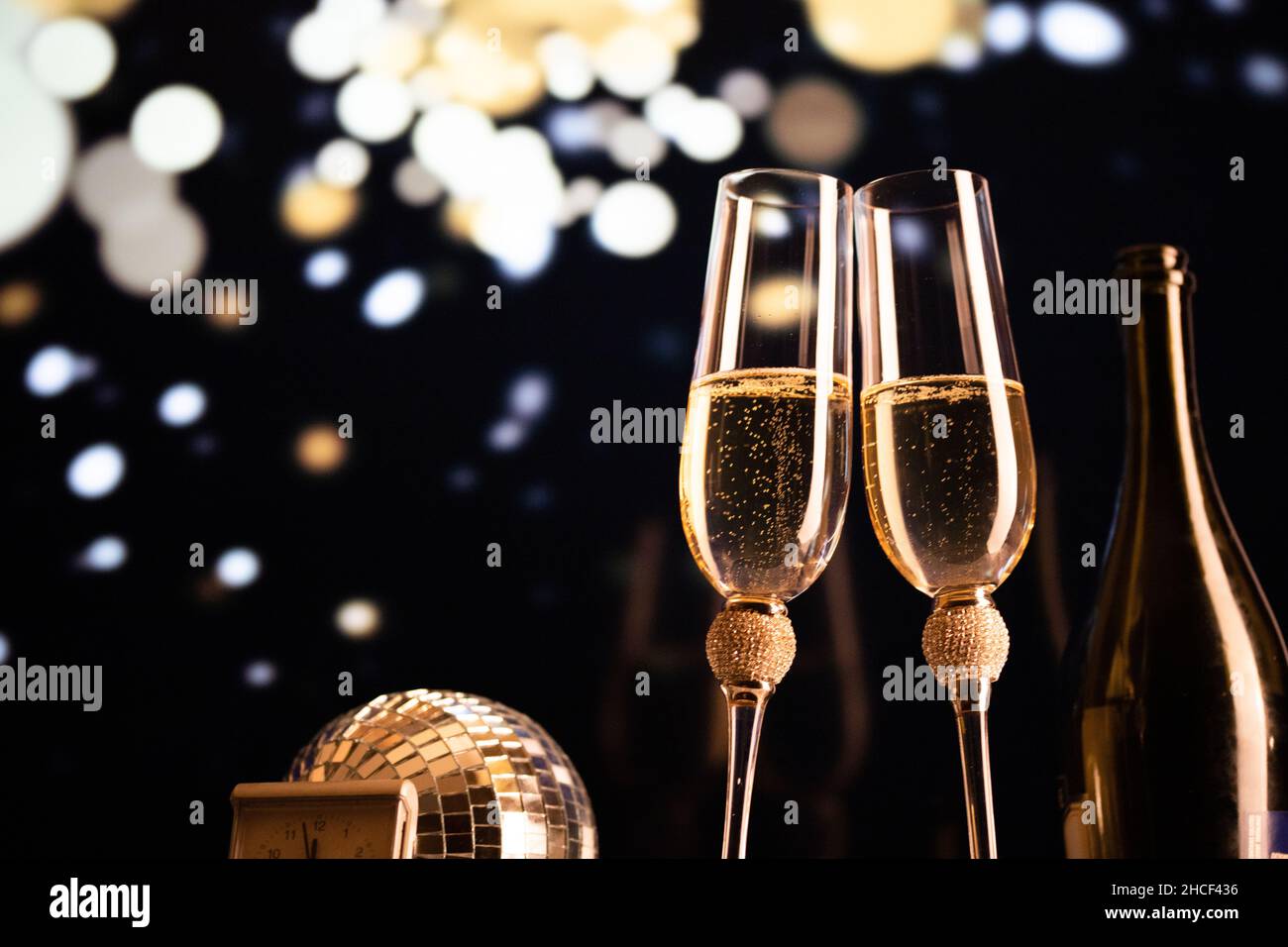 happy New Year champagne glasses and fireworks celebration background ...
