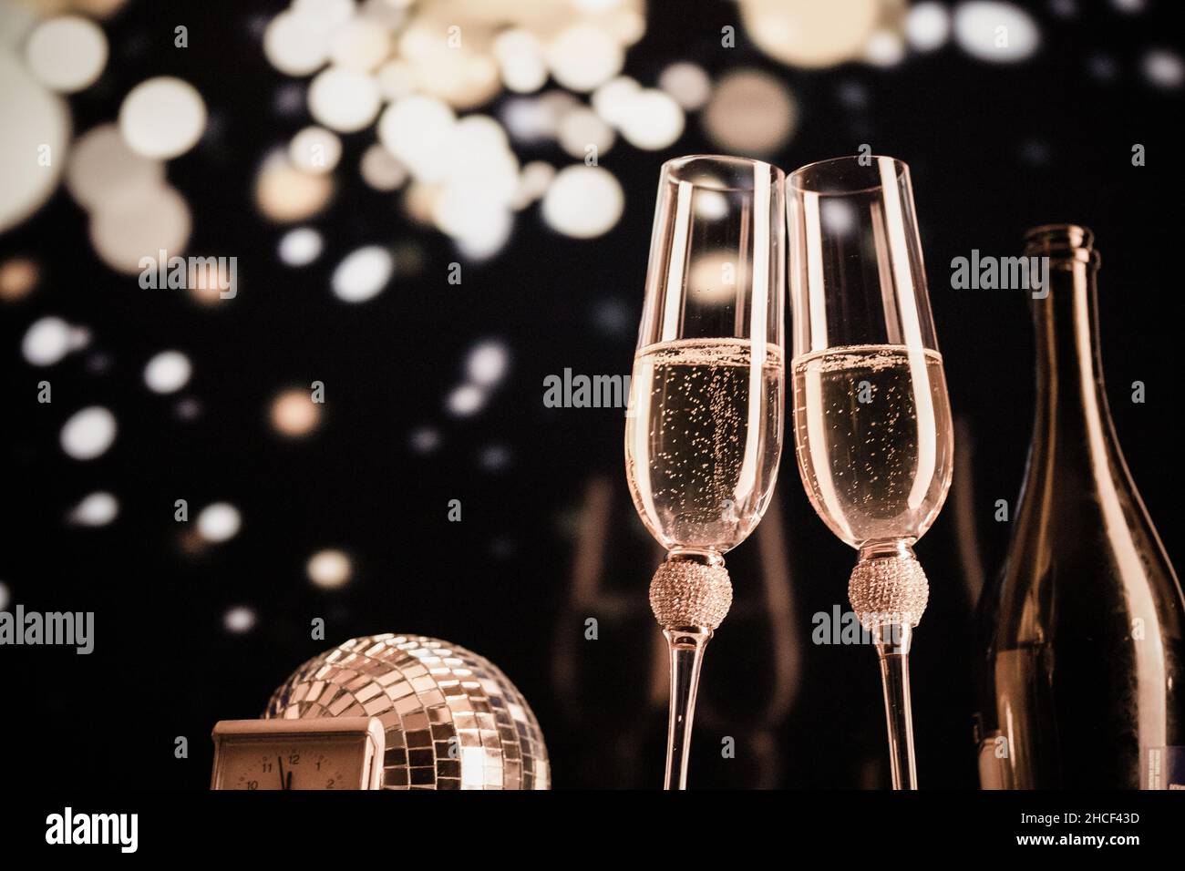 happy New Year champagne glasses and fireworks celebration background ...