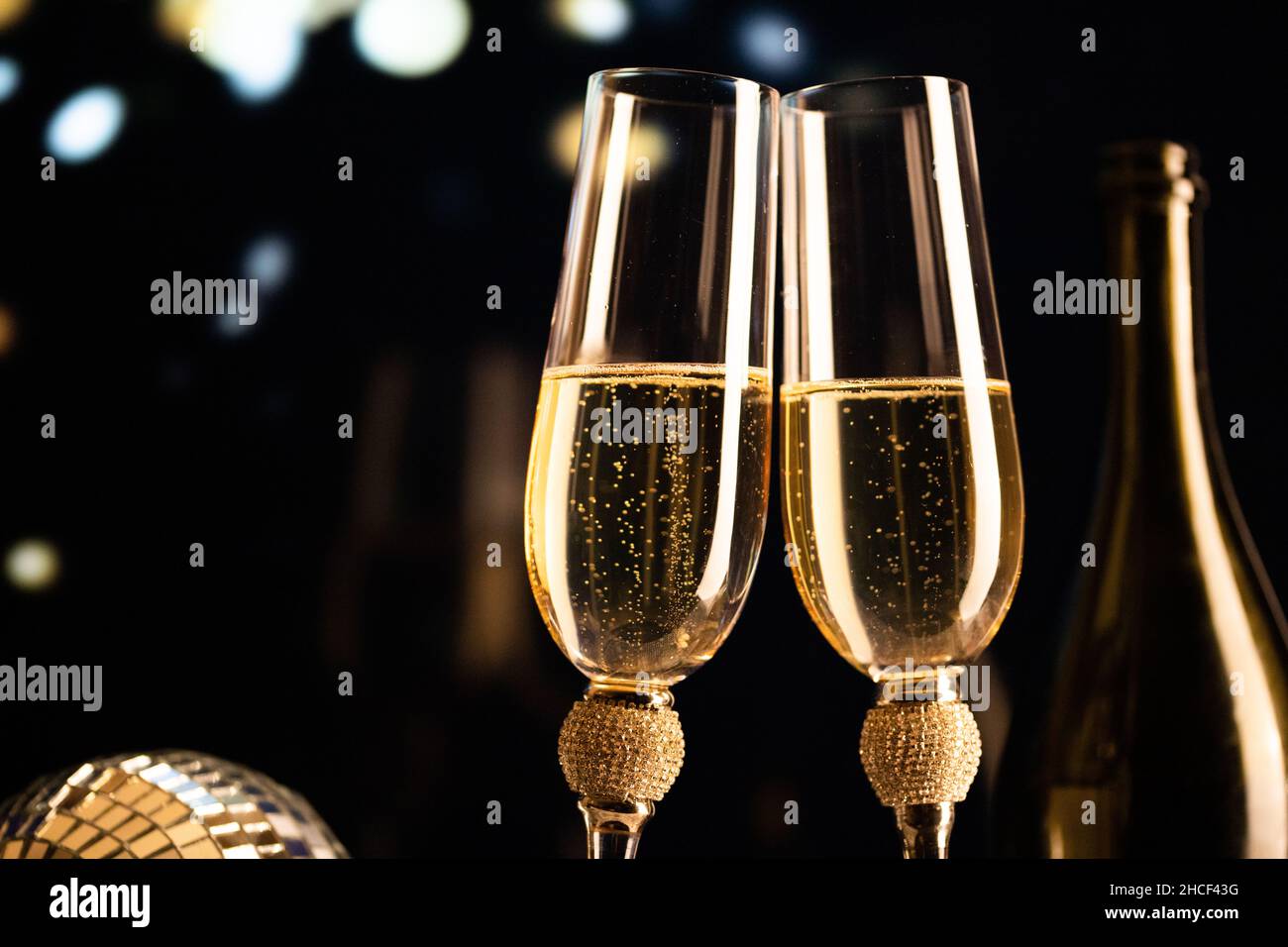 happy New Year champagne glasses and fireworks celebration background ...