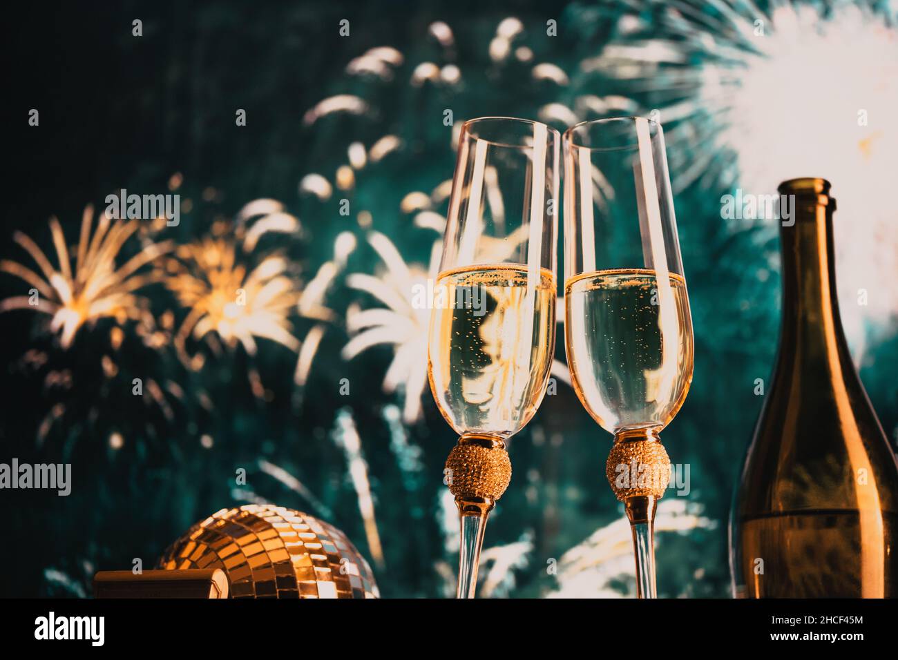 happy New Year champagne glasses and fireworks celebration background ...