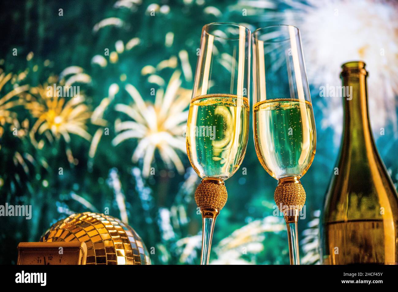 happy New Year champagne glasses and fireworks celebration background ...