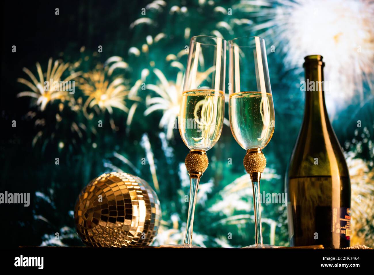 happy New Year champagne glasses and fireworks celebration background ...