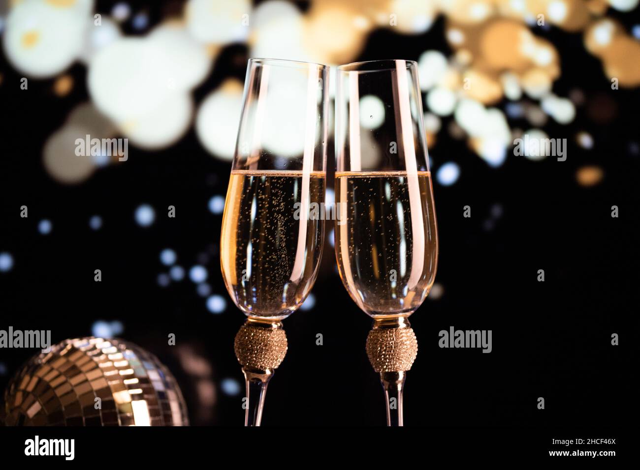 happy New Year champagne glasses and fireworks celebration background ...