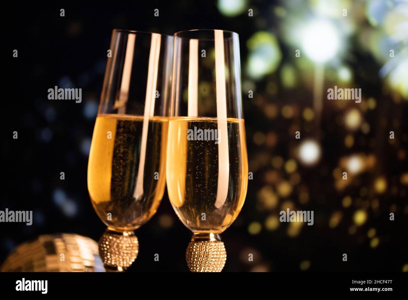 happy New Year champagne glasses and fireworks celebration background ...