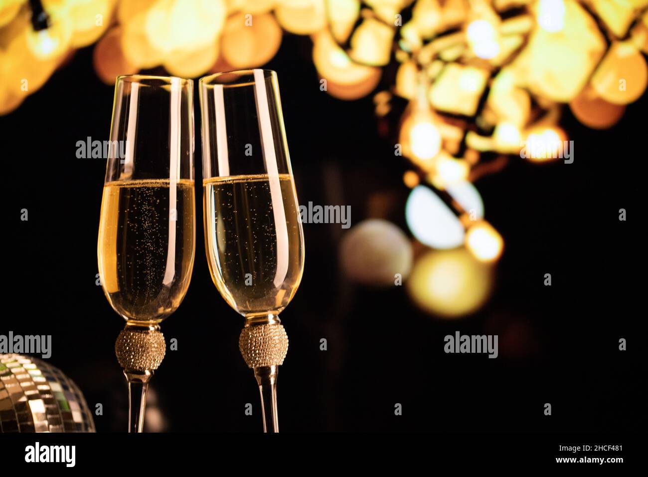 happy New Year champagne glasses and fireworks celebration background ...