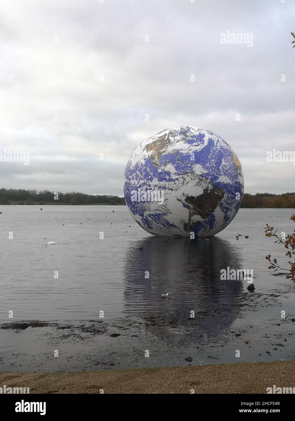 Vertical shot of the Floating Earth sculpture by artist Luke Jerram