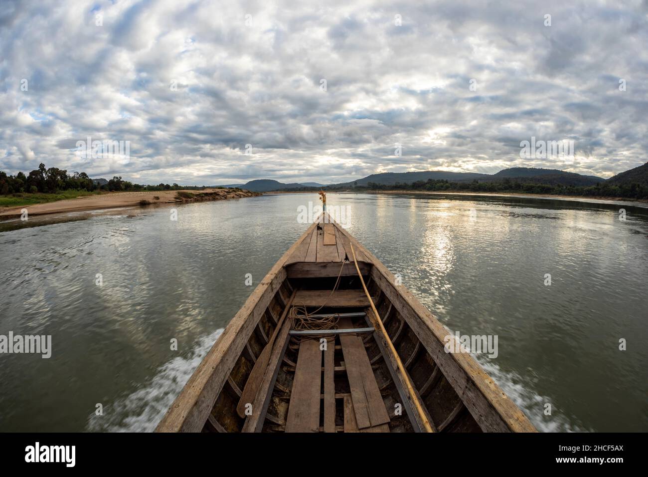 Traditional wooden boat sail on the khong river tropical bay to diving
