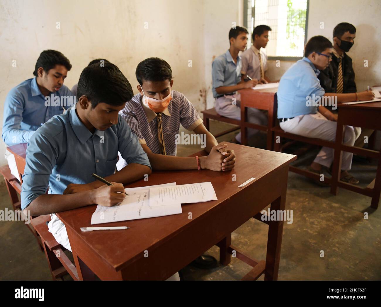 Visually impaired students answer questions during the higher secondary exam with the assistance