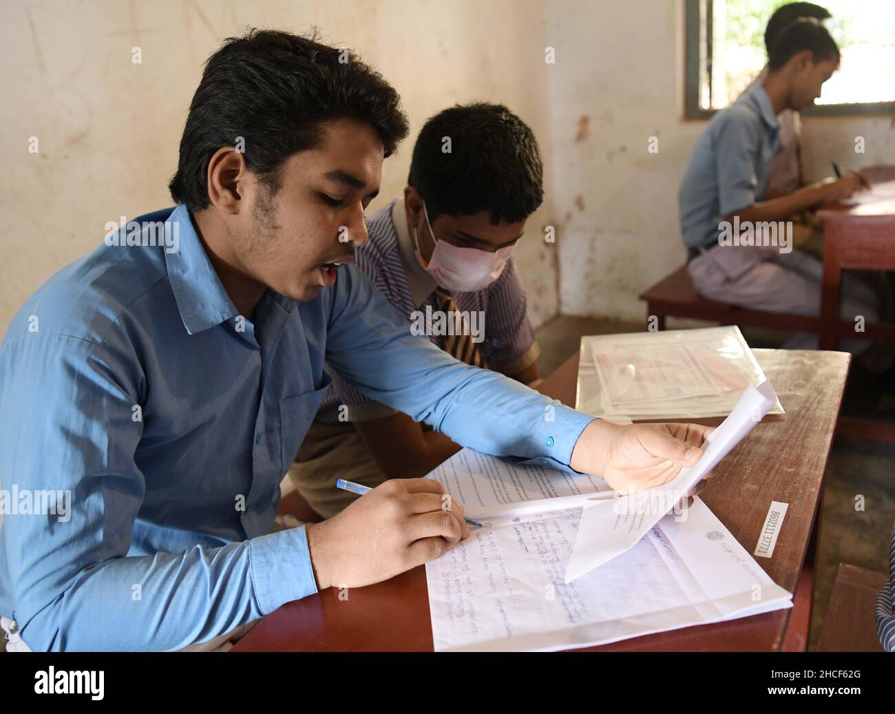 Visually impaired students answer questions during the higher secondary exam with the assistance