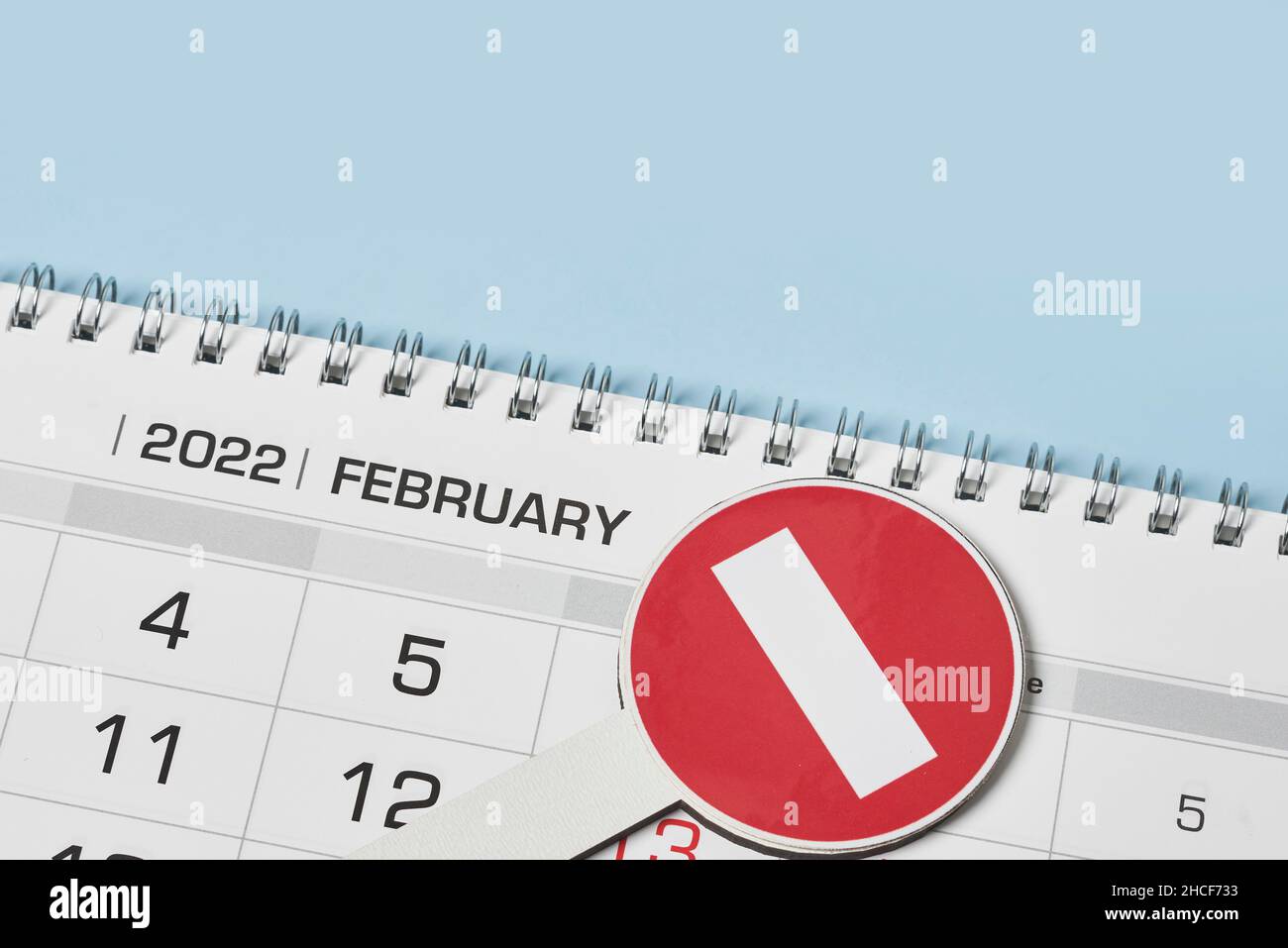 Closeup view of monthly calendar and No entry traffic sign. Symbol of