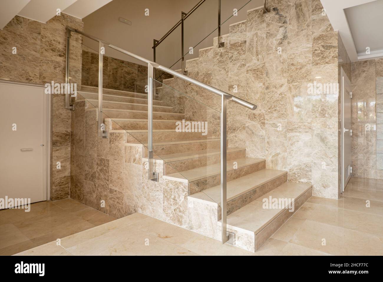 Marble stairs in the lobby of a residential apartment building Stock Photo