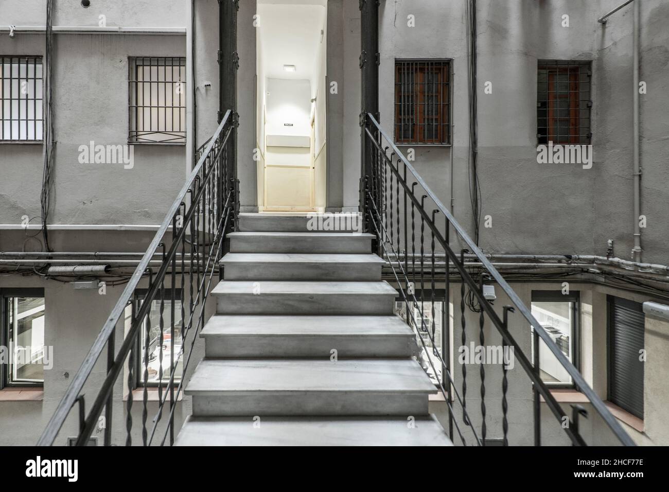 Interior stairs in the patio of lights of a vintage building Stock Photo