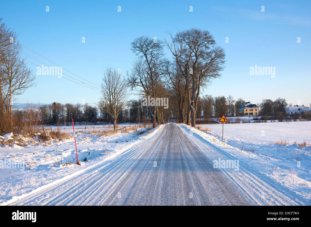 Winter road in Uppland, Sweden Stock Photo