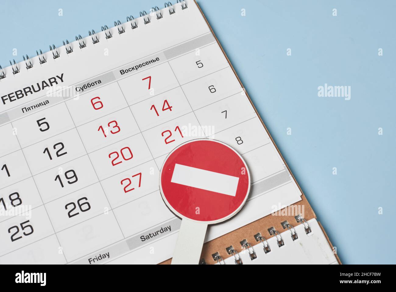 Closeup view of monthly calendar and No entry traffic sign. Symbol of