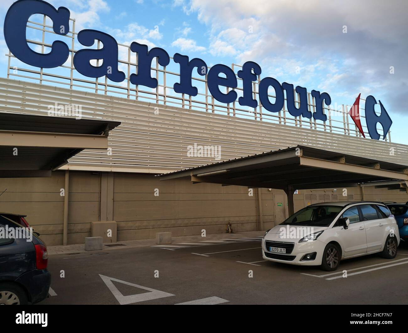 Logo of the Carrefour hypermarket. Malaga, Spain. Stock Photo