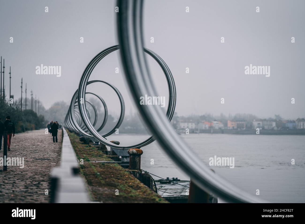 Selective focus of metal rings of the artist Daniel Buren along the river Loire in Nantes, France Stock Photo