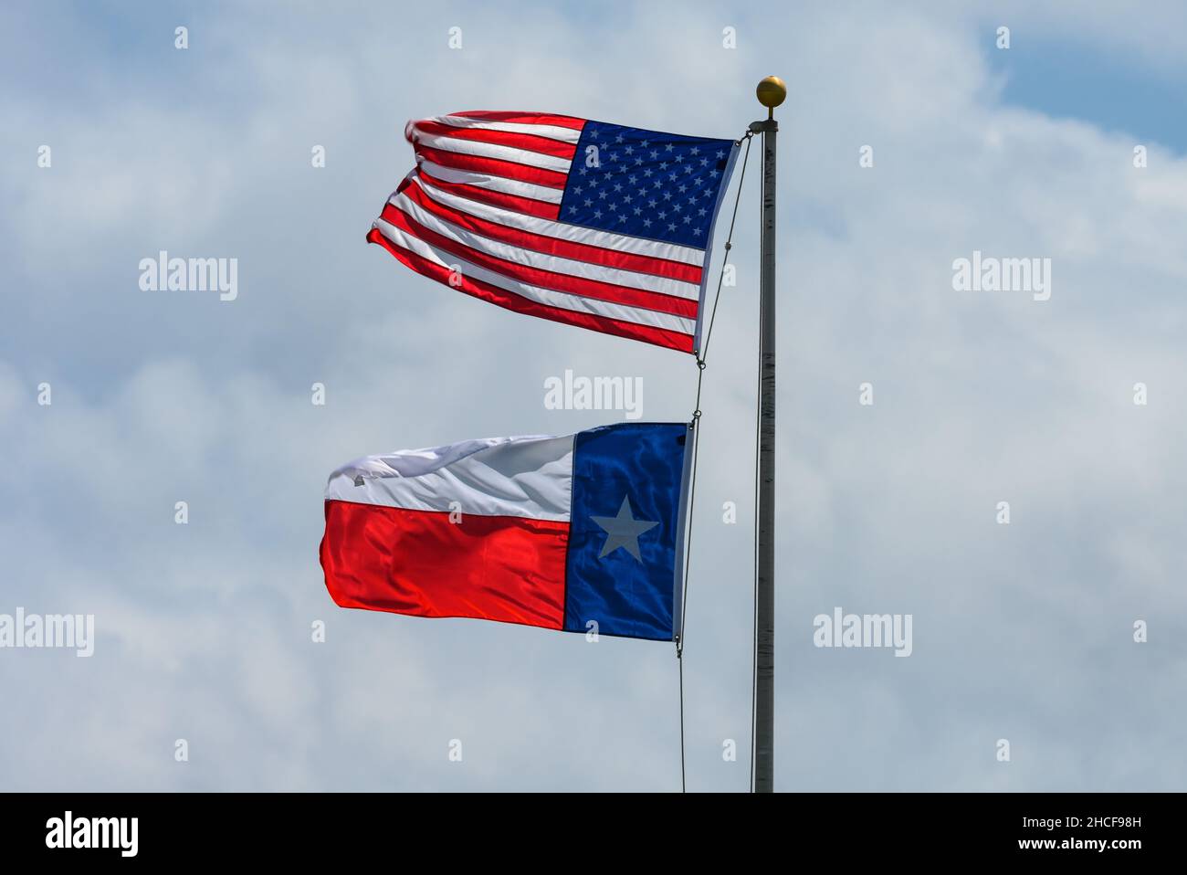 Flags of the United States and Texas waving in the wind. Houston, Texas, USA. Stock Photo