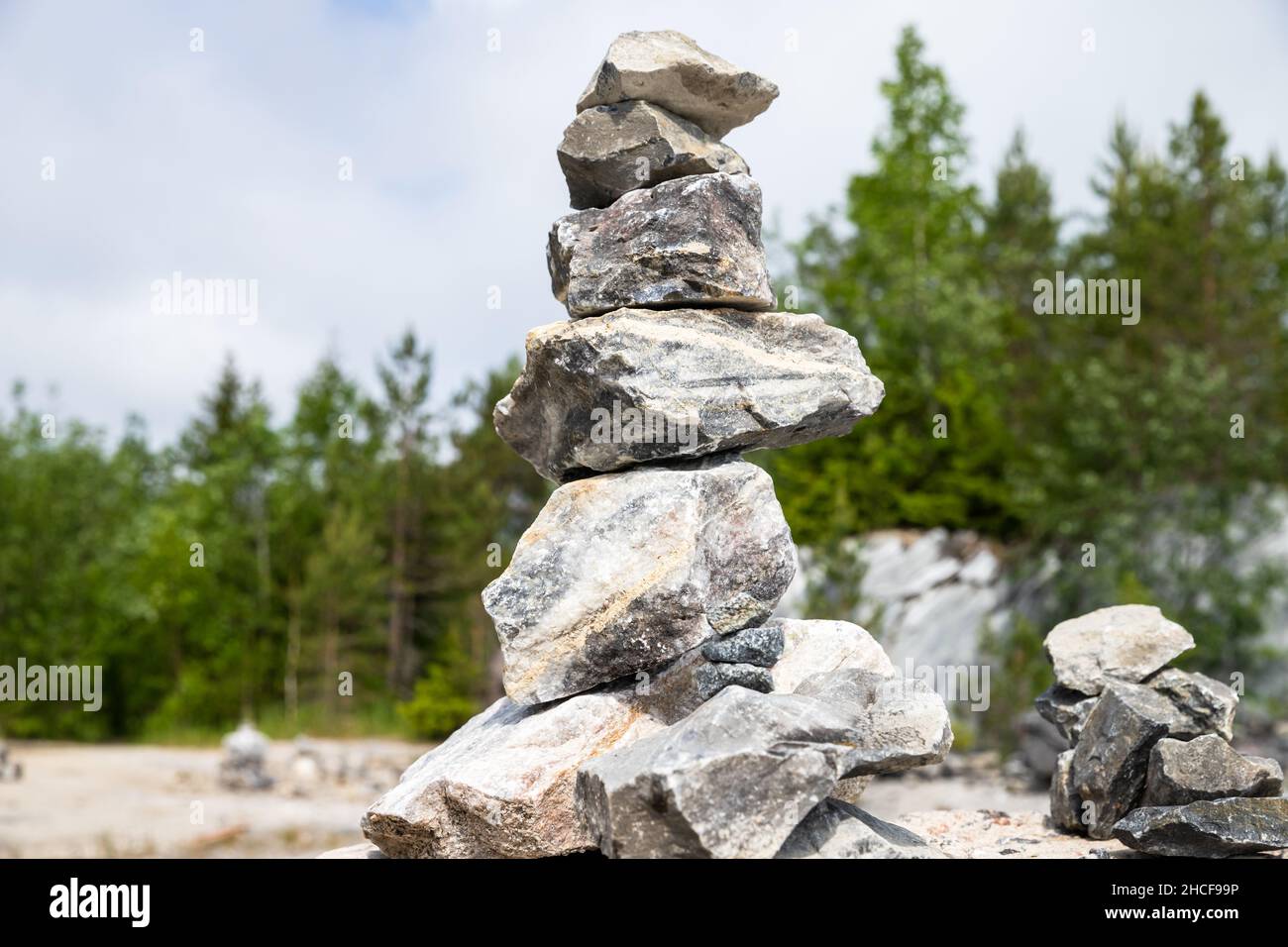 Stone cairn at former marble quarry in Karelia, Russia Stock Photo