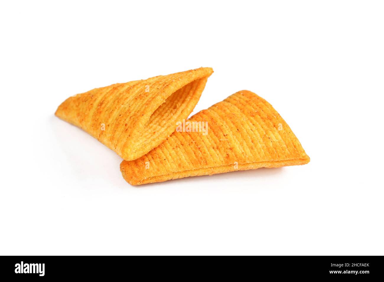 Two cone shaped crispy snacks isolated on white background Stock Photo