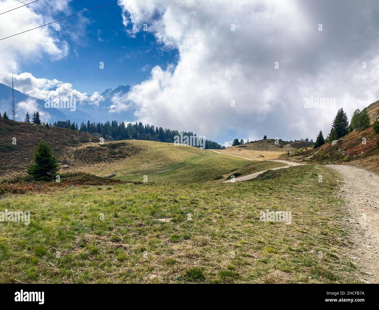 Hiking Trail on cloudy Sky near Bettmeralp, Aletsch Arena, Switzerland Stock Photo