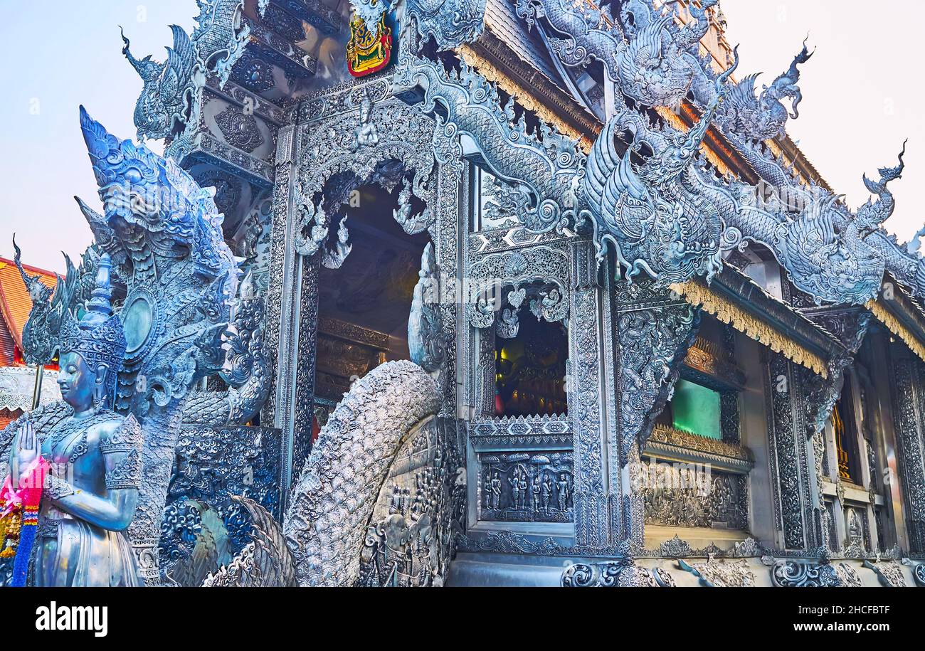 Exterior of the Ubosot of Wat Sri Suphan (Silver Temple) is decorated with different mythic creatures - Devas, angels, Garudas, Yakshas, swans, Chiang Stock Photo