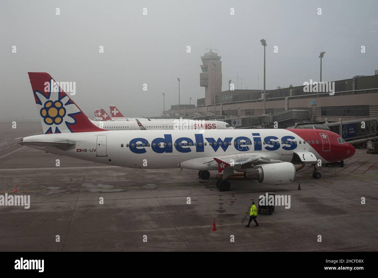 14.12.2021, Zurich, Switzerland, Europe - An Edelweiss Air Airbus A320 passenger aircraft is parked at a gate of Terminal A at Zurich Airport. Stock Photo