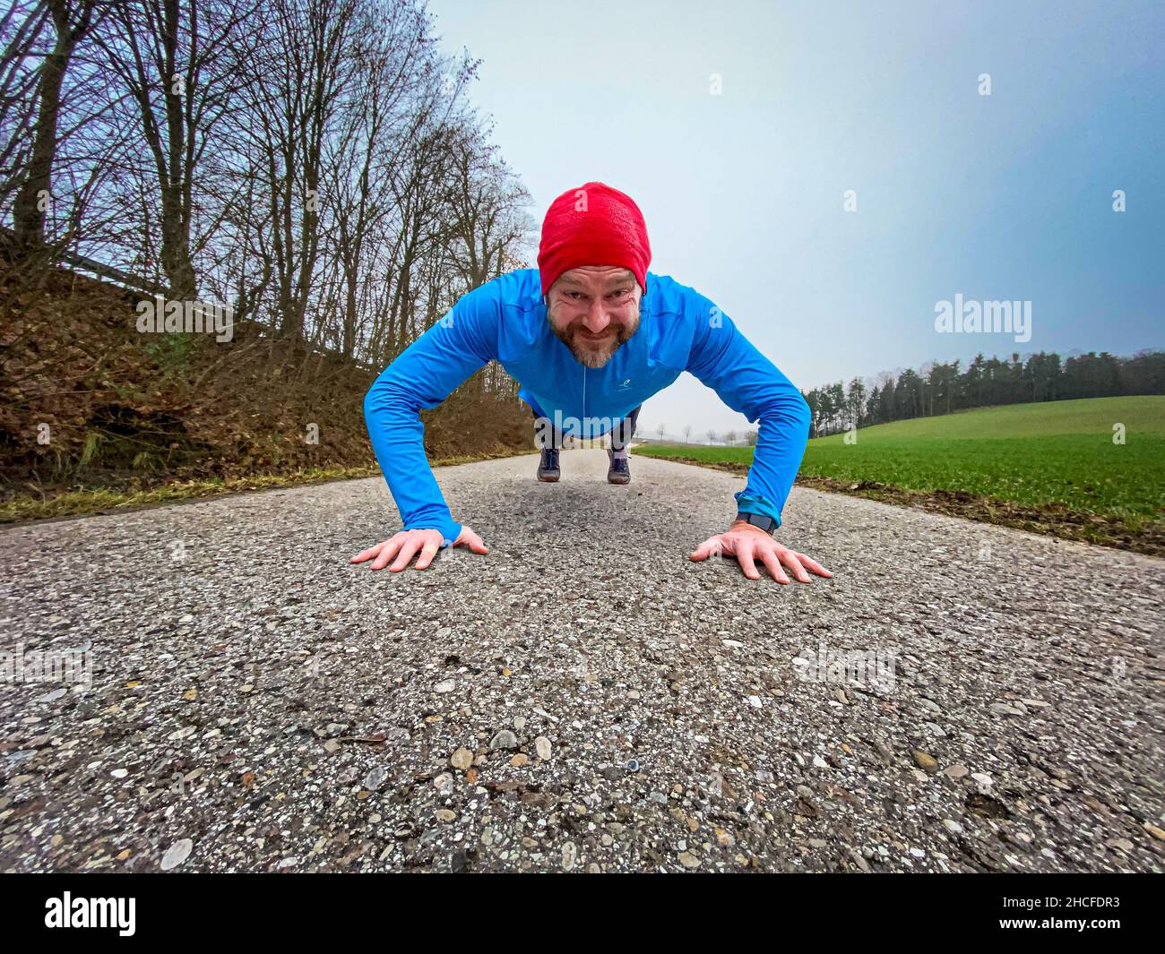 Man run trail blue shirt hires stock photography and images Alamy