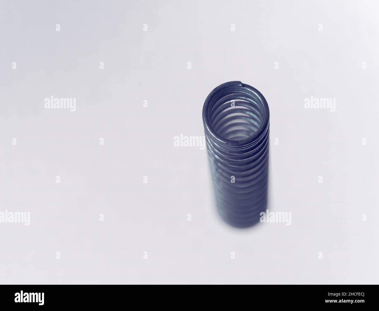 Close-up picture of a rusty gold and silver screw on a white background Stock Photo
