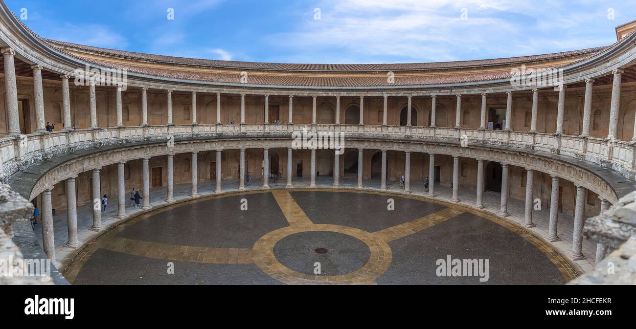 Granada Spain - 09 14 2021: Interior circular Patio on Charles V Palace, Doric and stylized Ionic colonnade of conglomerate stone, Renaissance buildin Stock Photo