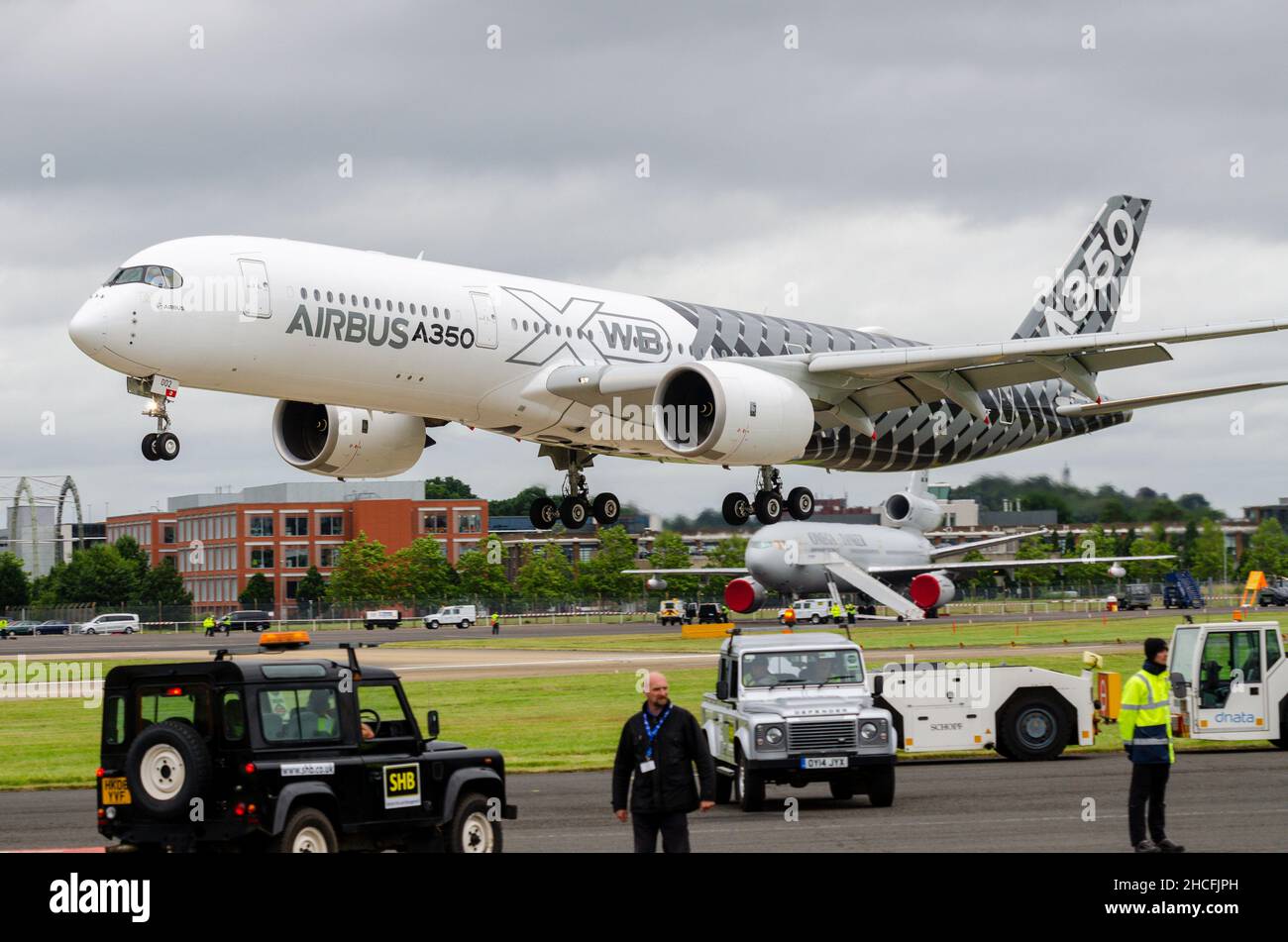 Airbus A350 XWB test aircraft in carbon fibre colour scheme landing at Farnborough International Airshow for demonstration display flights. Prototype Stock Photo
