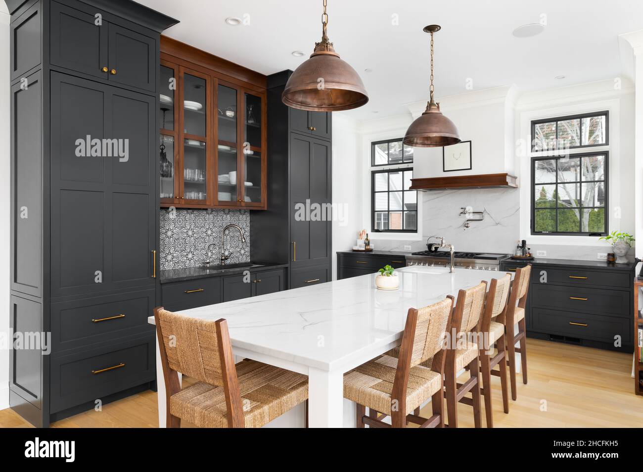 A luxurious kitchen with dark grey bronze dome light fixtures