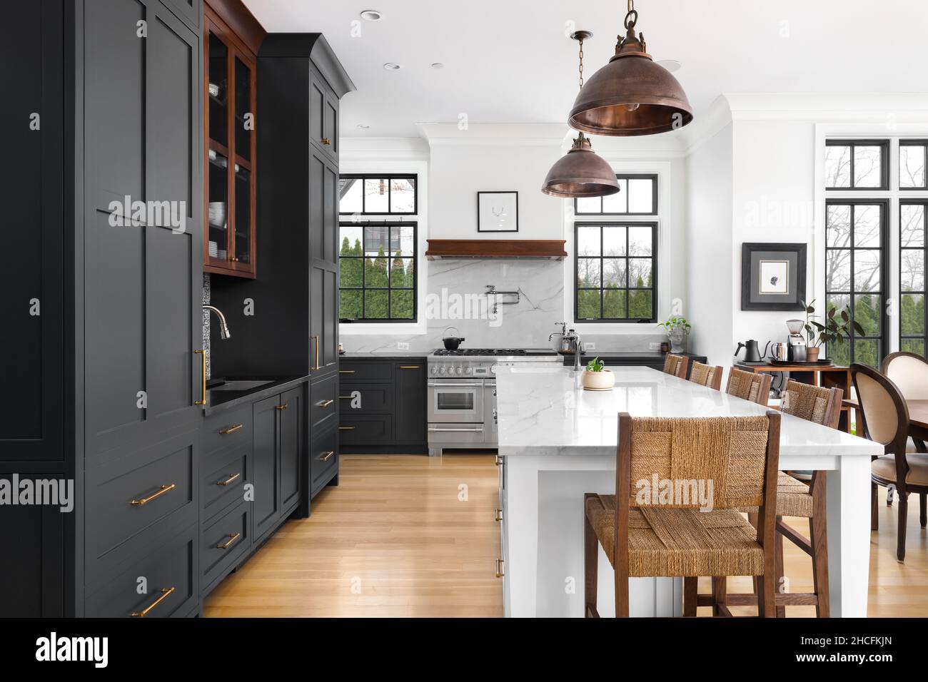 A luxurious kitchen with dark grey bronze dome light fixtures
