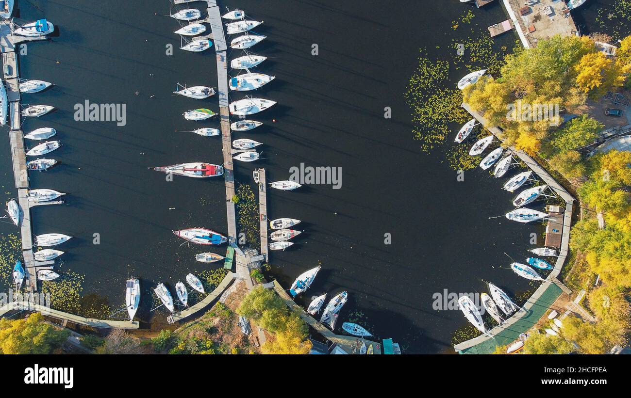 Beautiful igh angle view of yachts in Riviera Riverside and trees in Dnieper river in Kyiv, Ukraine Stock Photo