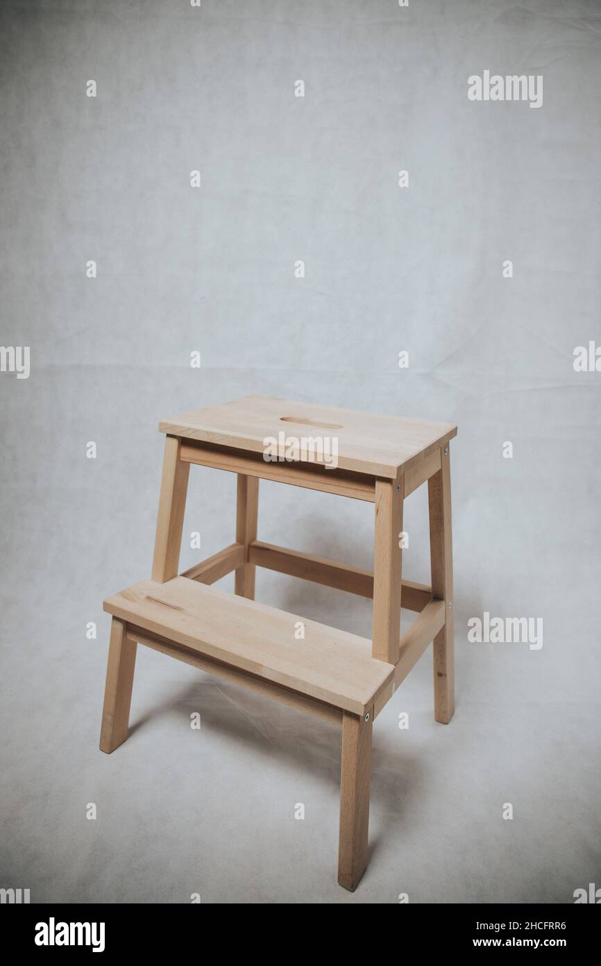 Wooden step stool ion white background Stock Photo