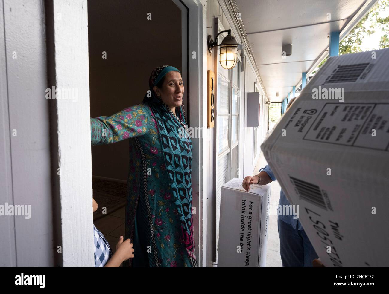 Austin Texas USA, October 2021 Members of an Afghan family move
