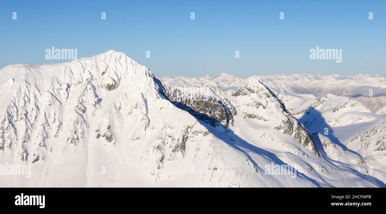 Aerial Panoramic View of Canadian Mountain covered in snow Stock Photo ...
