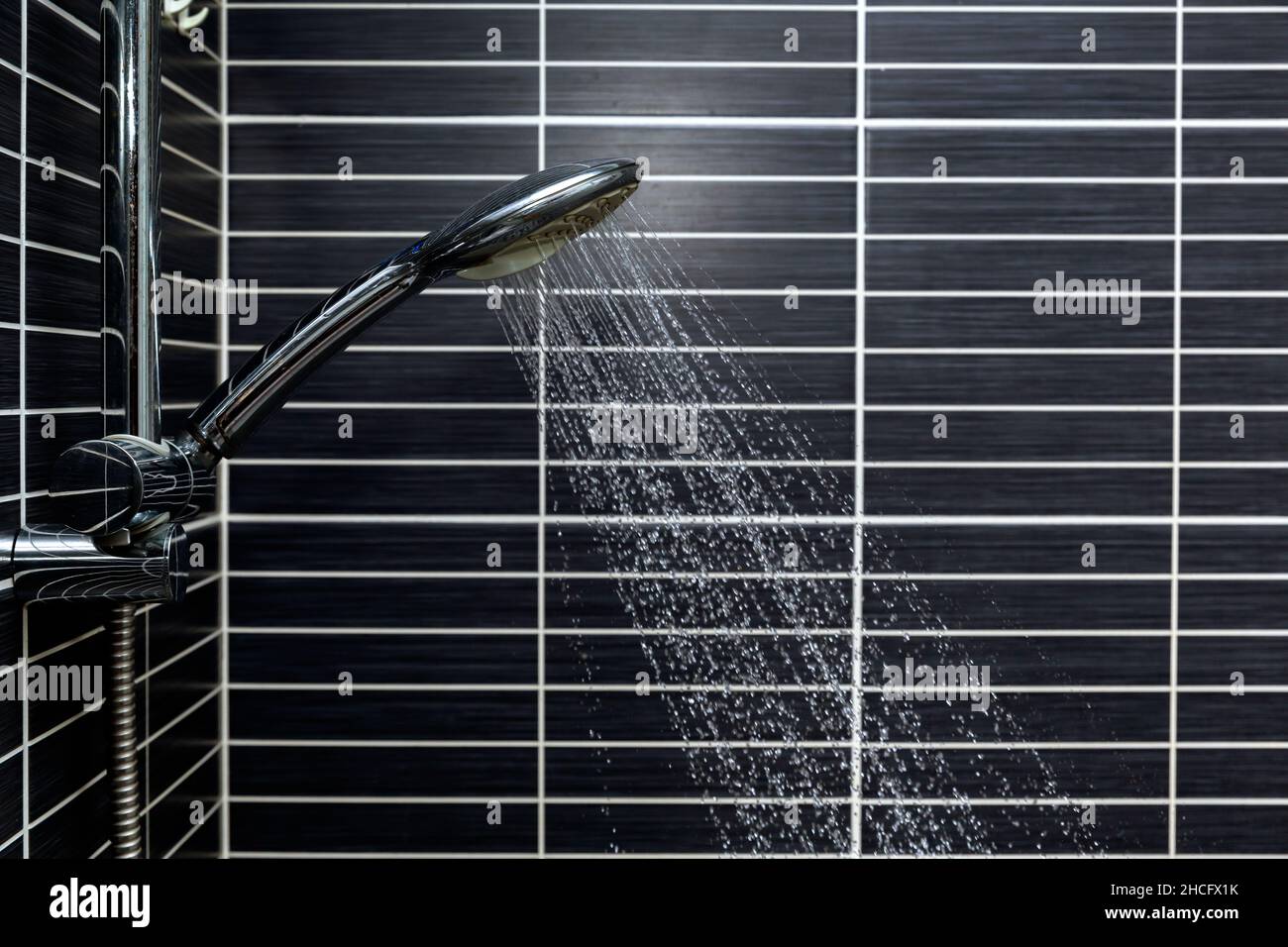 front view, drops of water falling into the bathroom Stock Photo - Alamy