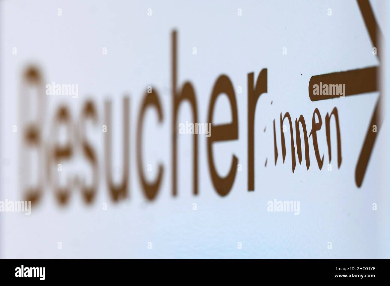 28 December 2021, Baden-Wuerttemberg, Tübingen: The word 'visitor' is added to the word ':innen' on a sign in the city centre. (to dpa 'Schopper for serenity in gendering: Teachers have other concerns') Photo: Marijan Murat/dpa Stock Photo