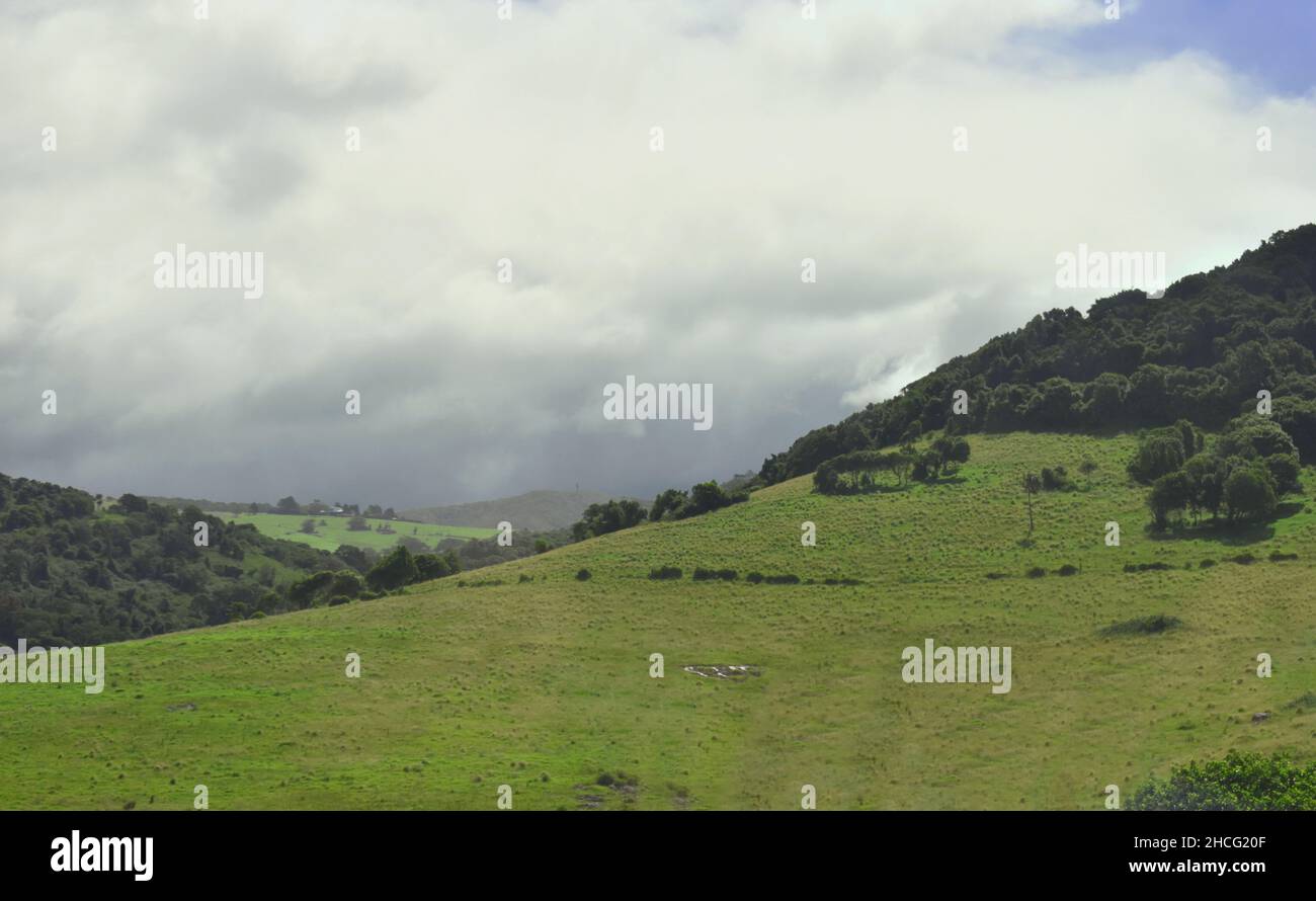 fields and cleared pasture lands on the rolling hills of Kangaroo Valley, NSW, Australia Stock Photo