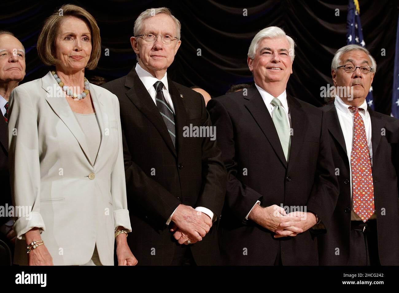 United States Speaker of the House Nancy Pelosi (D-CA), U.S. Senate Majority Leader Harry Reid (D-NV), U.S. Senate Banking Committee Chairman Christopher Dodd (D-CT) and U.S. House Financial Services Committee Chairman Barney Frank (D-MA) attend the signing ceremony for the financial reform bill into law during a ceremony with at the Ronald Reagan Building and International Trade Center, Wednesday, July 21, 2010 in Washington, DC. A sweeping expansion of federal financial regulation in the wake of the worst recession since the Great Depression, the bill will create a consumer protection agency Stock Photo