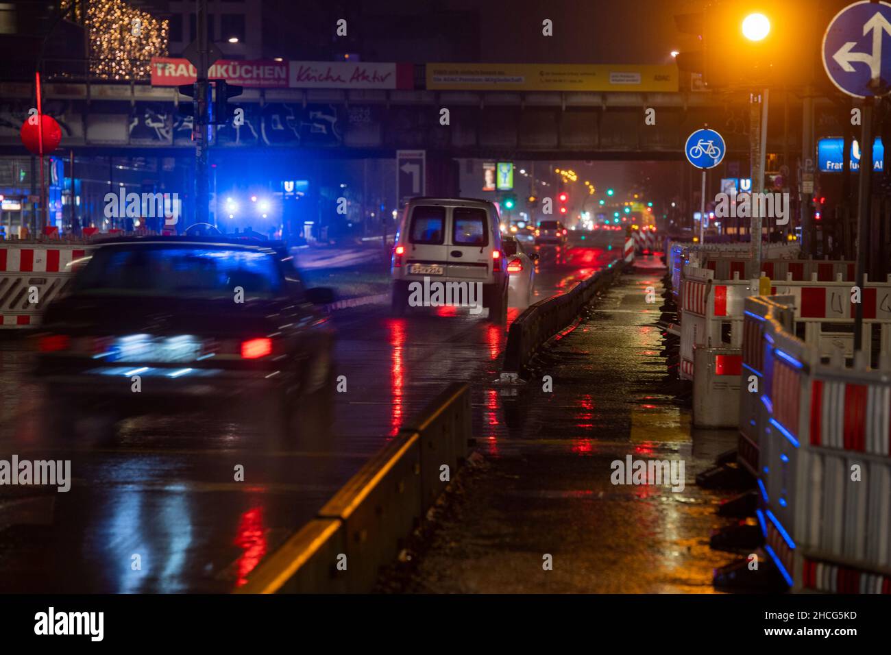 Berlin, Germany. 28th Dec, 2021. Cars drive on Frankfurter Allee during  rainy weather. Black ice can occur due to over-freezing wetness or freezing  rain. Credit: Christophe Gateau/dpa/Alamy Live News Stock Photo -